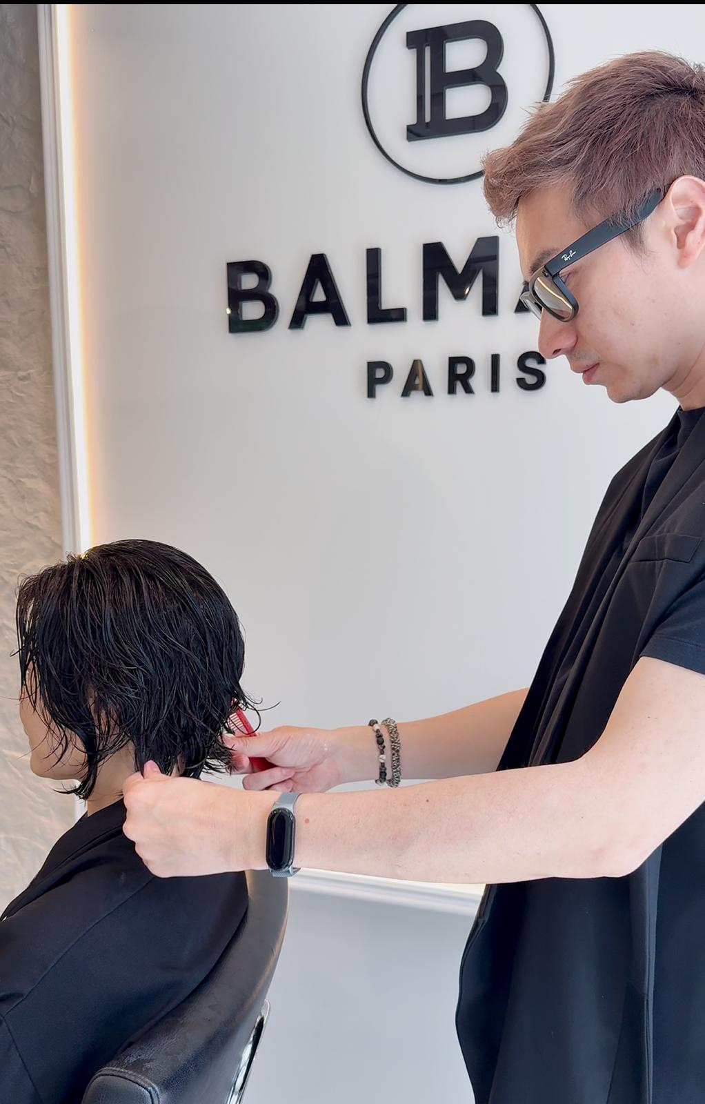 Ken Hung performing women's aura precision hair cutting at Salon Era Vancouver - luxury consultation and personalized styling approach