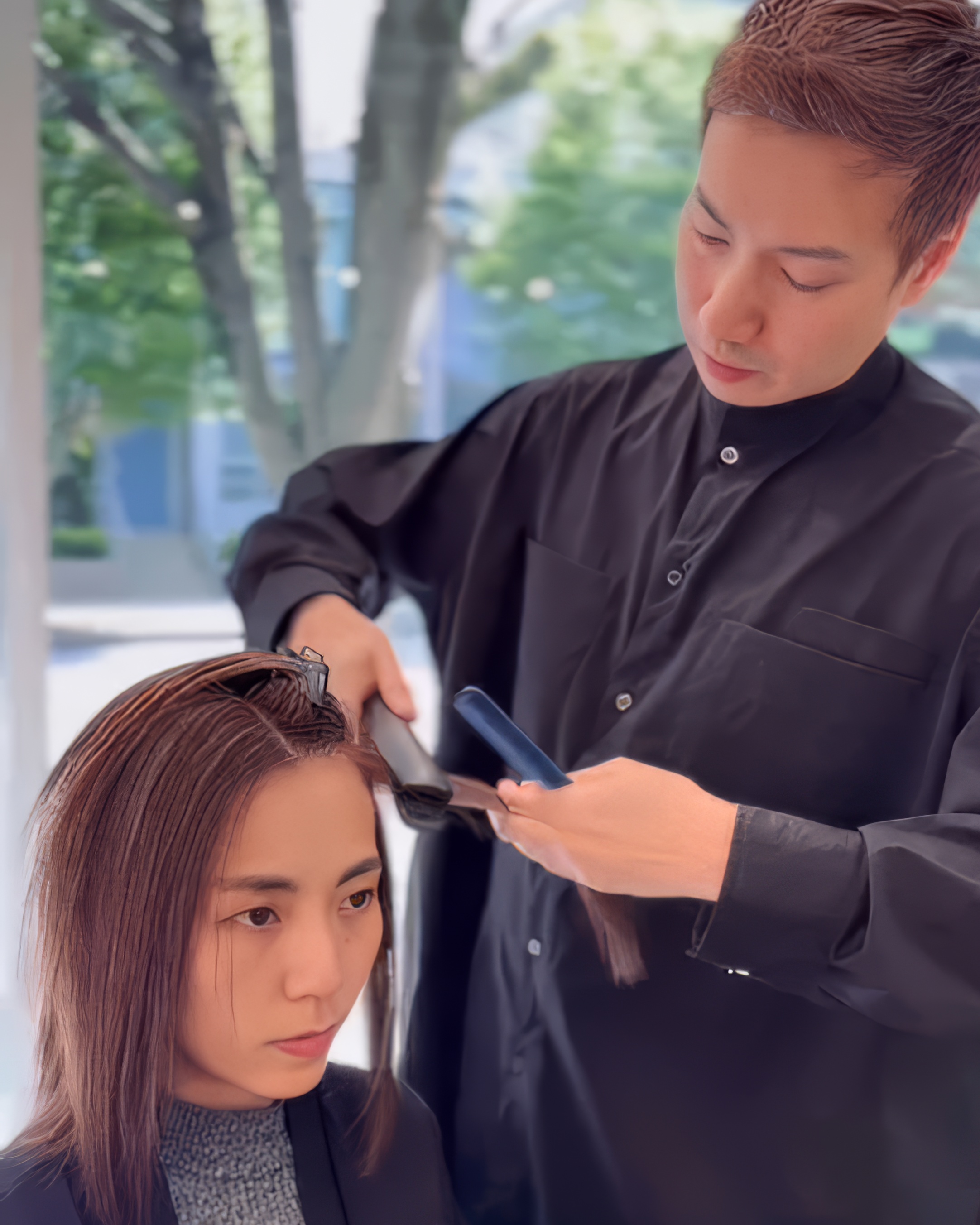 Ken Hung working on aura precision haircuts at Salon Era Vancouver - master stylist demonstrating advanced cutting techniques